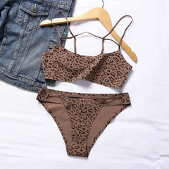 Leopard print bikini set with denim jacket on a white background