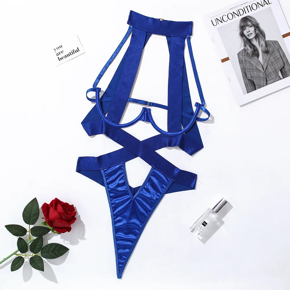 Blue satin lingerie set with a red rose and magazine on a white background