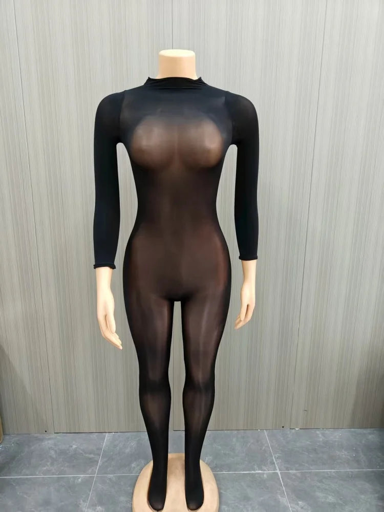 Mannequin wearing a black bodysuit with sheer panels against a gray background