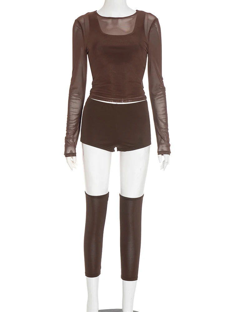 Brown outfit with sheer sleeves and white pants on a mannequin against a white background