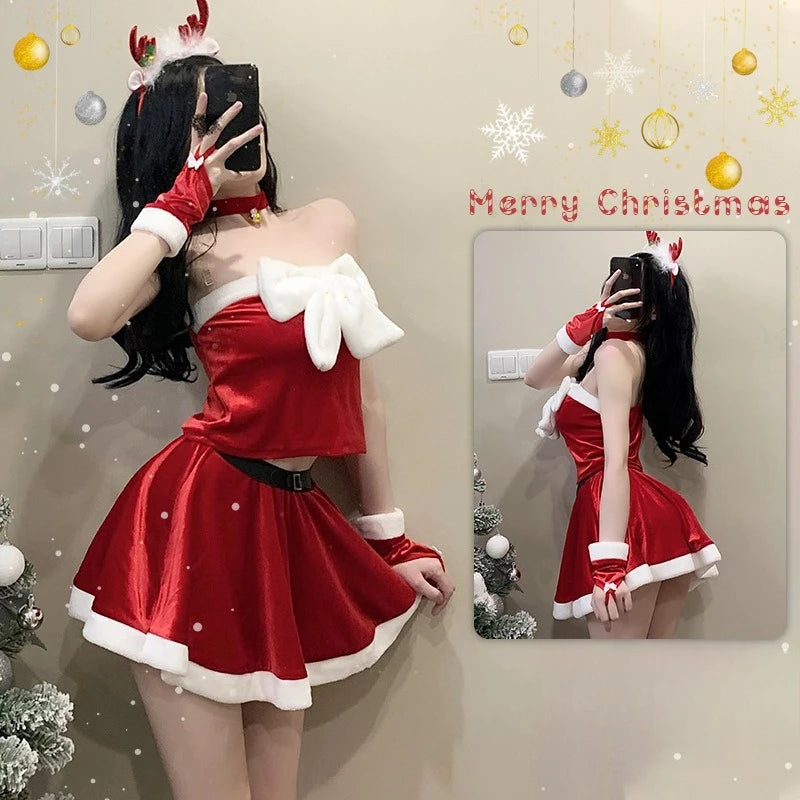 Person in a red Christmas costume taking a mirror selfie with festive decorations.