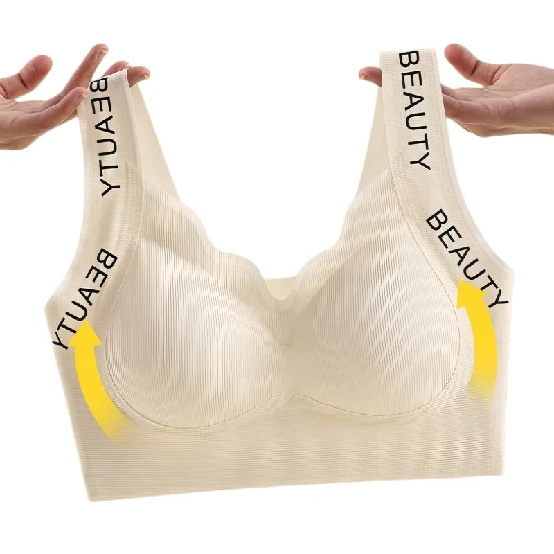 Beige bra with 'BEAUTY' and 'YTUA' text on straps against a white background