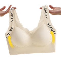 Beige bra with 'BEAUTY' and 'YTUA' text on straps against a white background