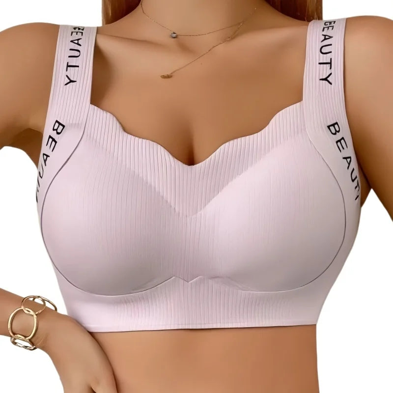 Light pink bra with 'BEAUTY' straps on a white background