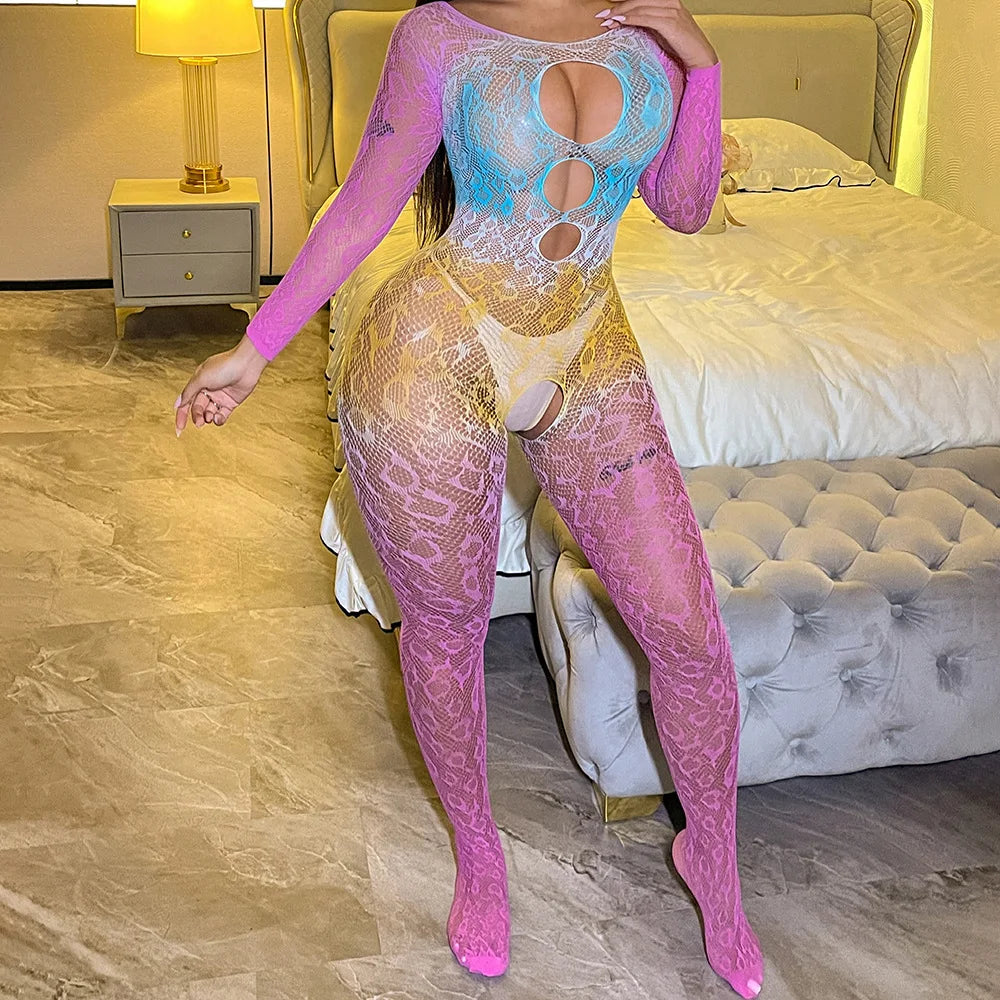 Person wearing a see-through outfit with pink and blue elements in a bedroom setting.
