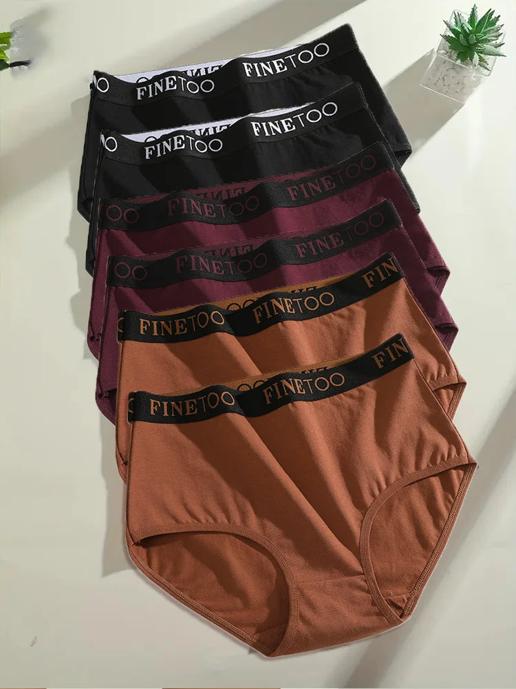 Stack of men's underwear with 'FINE TOO' branding on a white surface.