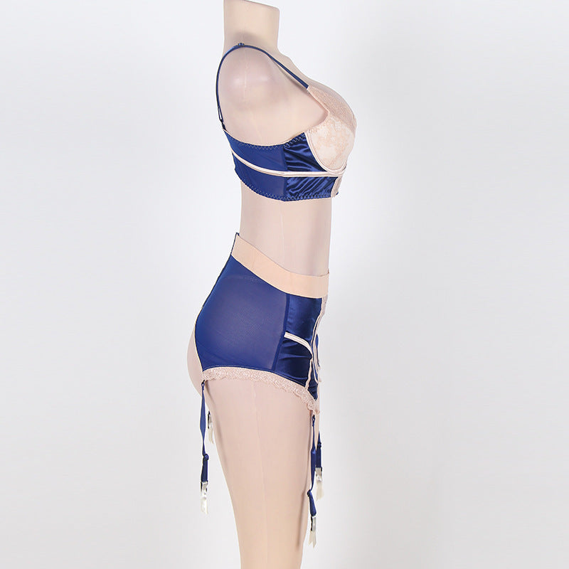 Mannequin wearing a blue and beige swimsuit on a white background
