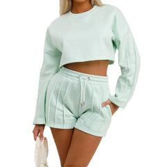 Light green sweatshirt and shorts set on a white background