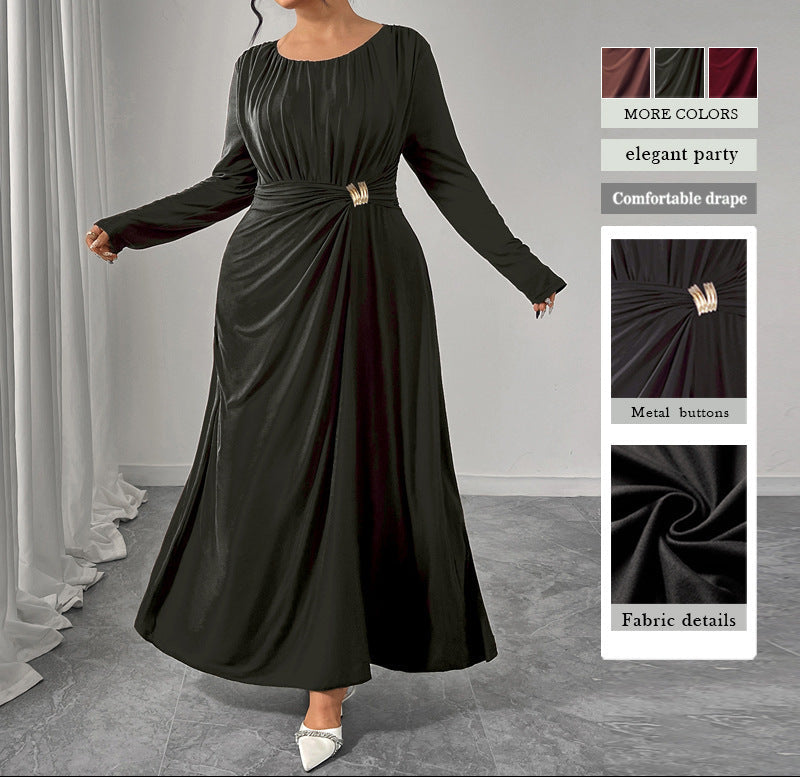 Black long-sleeve dress with a belt worn by a model, displayed against a neutral background.