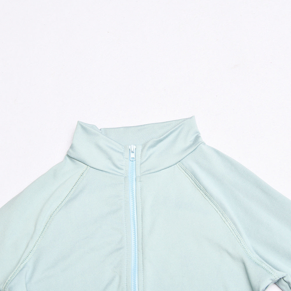 Light blue athletic jacket with a zipper on a light gray background