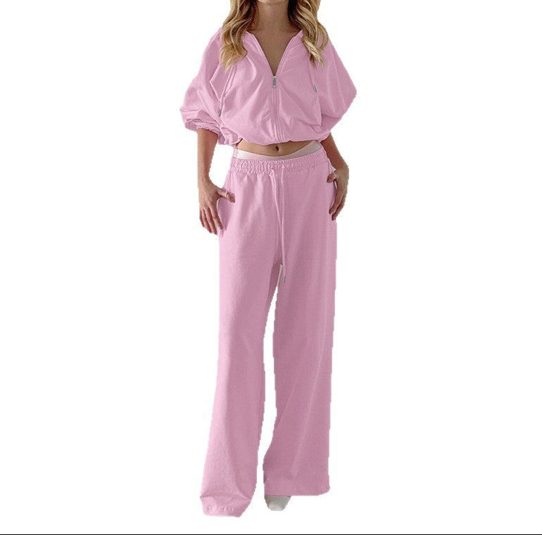 Woman wearing a pink outfit on a white background