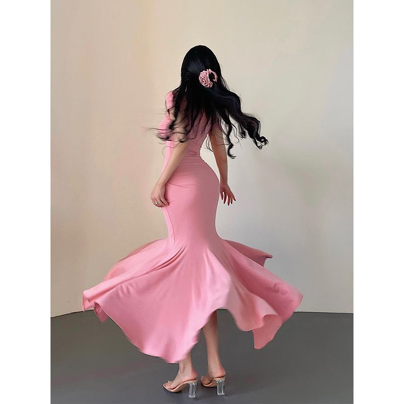 Woman in a pink dress with a blurred background