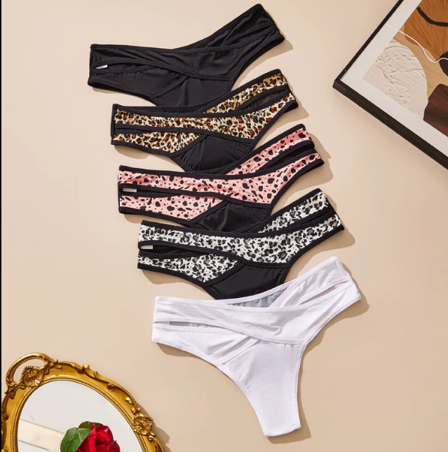 Three-piece leopard print and solid thong underwear pack displayed together